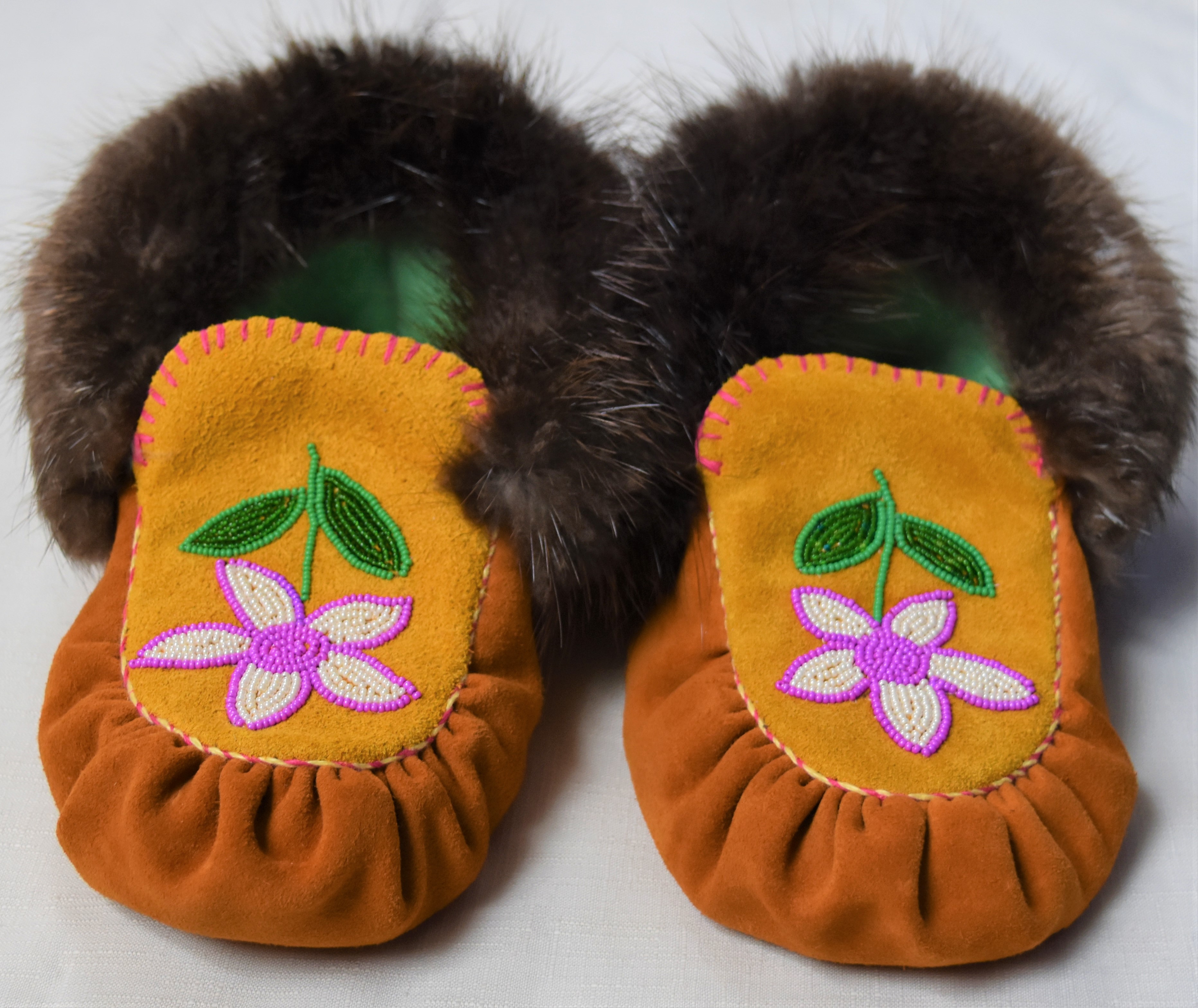 Pair of beaded hide moccasins made by Maggie Stewart